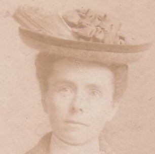 A woman in an old fashioned hat